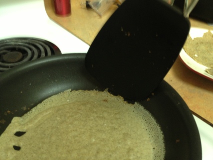Push the edges of the crepe down the side of the pan with a spatula. 